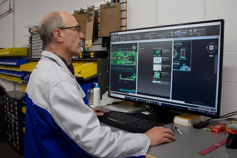 Technician inspecting a high-performance spindle
